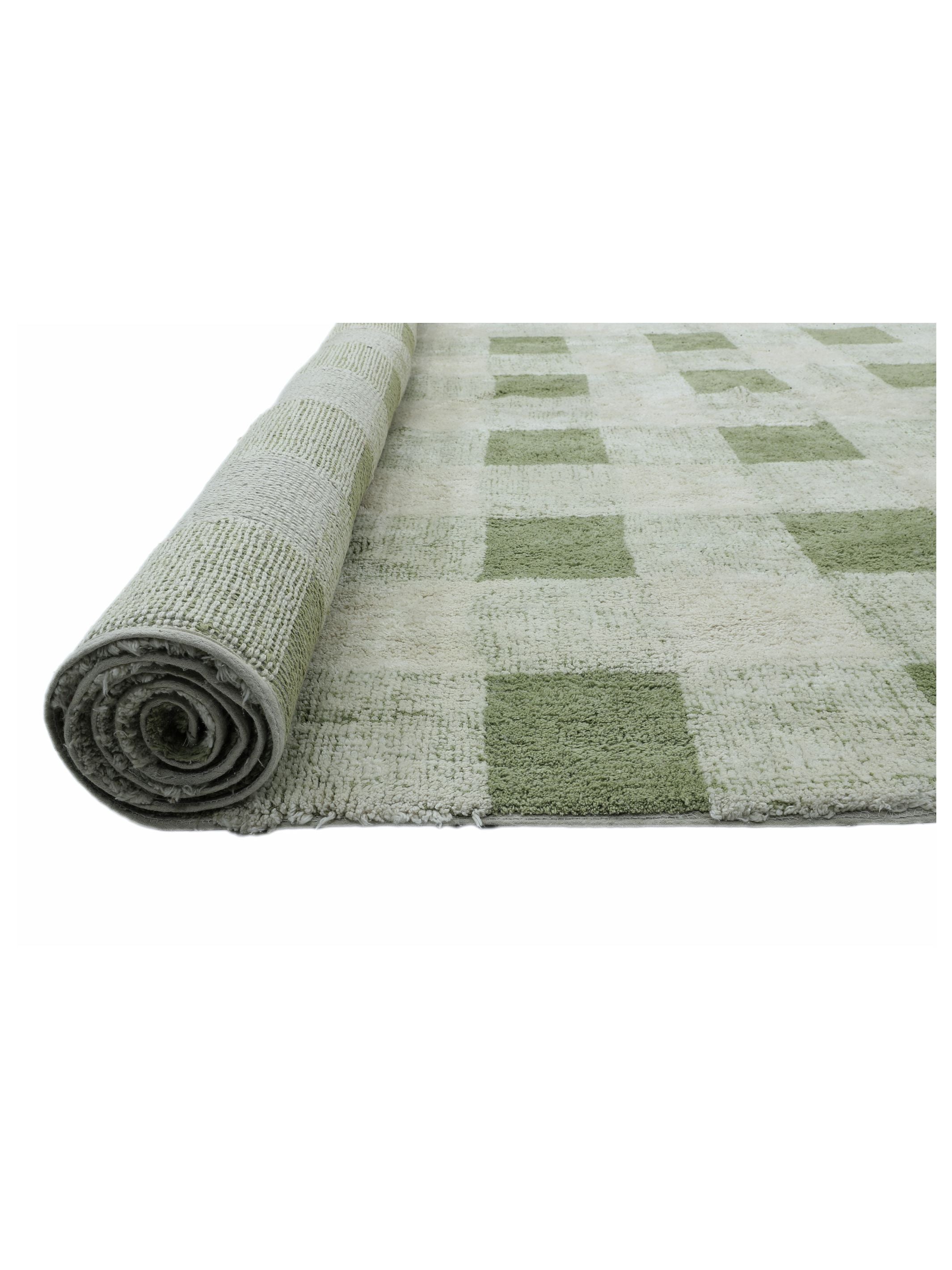 Rolled-up checkered rug with green and beige pattern on a white background