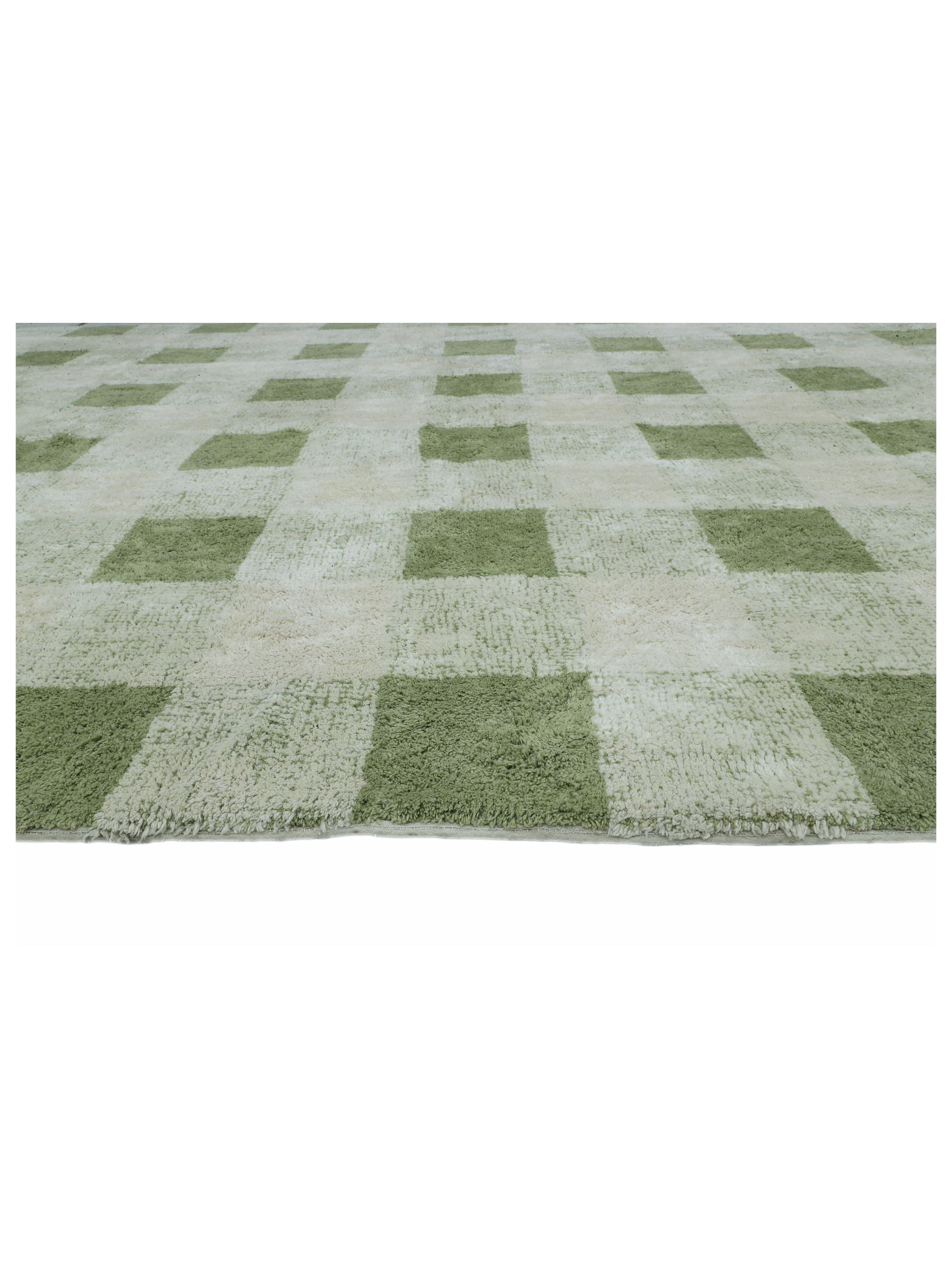 Green and white checkered rug on a white background